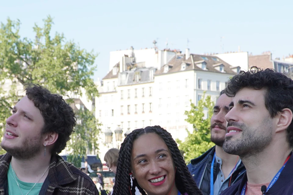 Small group and guide in front of Notre Dame Cathedral