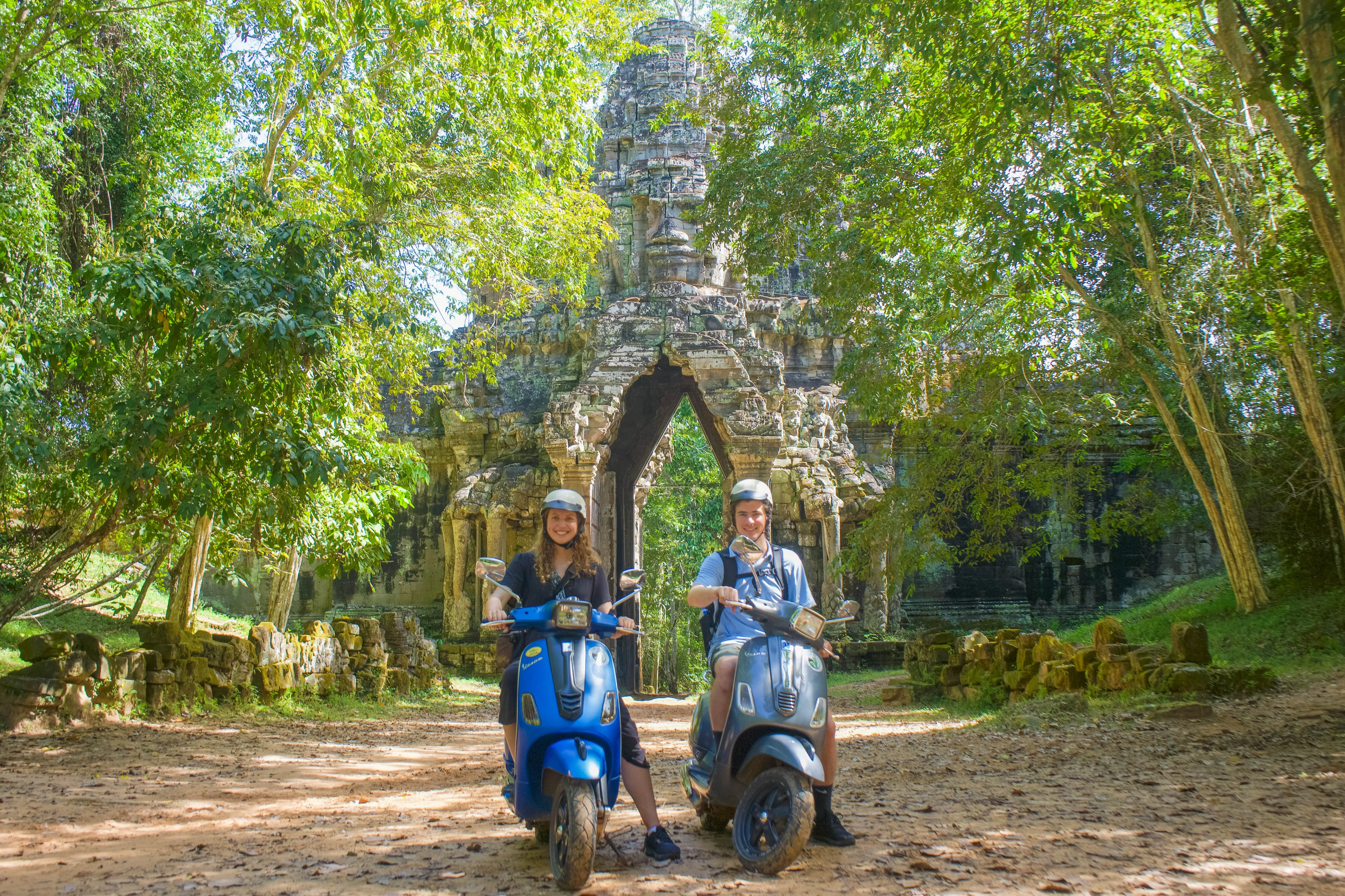 Enjoy the scenic ride on a vintage Vespa through Angkor Park with our driver.

