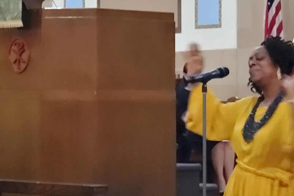 An inspiring image of a vibrant Gospel Choir passionately singing.